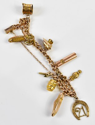 Lot 288 - A 9ct rose gold charm bracelet set with a...