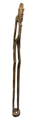 Lot 561 - A large 20th century carved African standing...