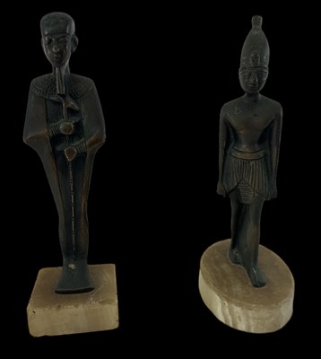 Lot 567 - Two 20th century Ancient Egyptian style bronze...
