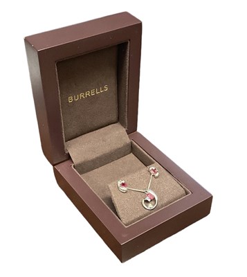 Lot 657 - A suite of 9ct white gold ruby and diamond set...