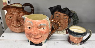 Lot 528 - ROYAL DOULTON; a group of three character jugs,...