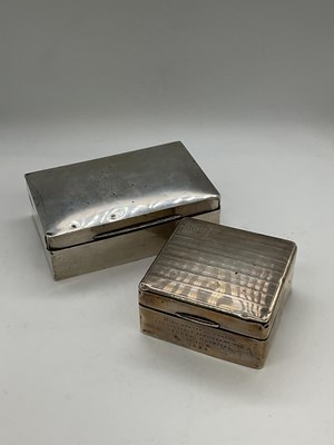 Lot 1083 - Two George V hallmarked silver cigarette boxes,...