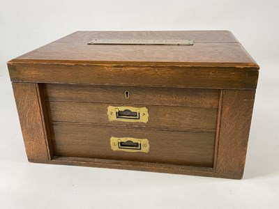 Lot 1095 - An oak canteen case containing a harlequin...