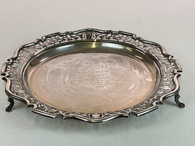 Lot 1033 - An Edwardian hallmarked silver circular tray...