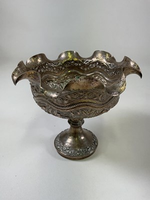 Lot 1049 - A large Indian silver embossed pedestal bowl...