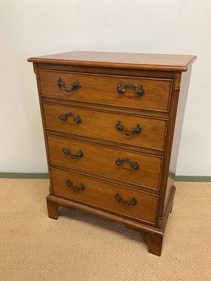 Lot 679 - A reproduction small mahogany chest of four...