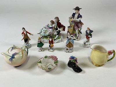 Lot 488 - A collection of Continental porcelain figures...