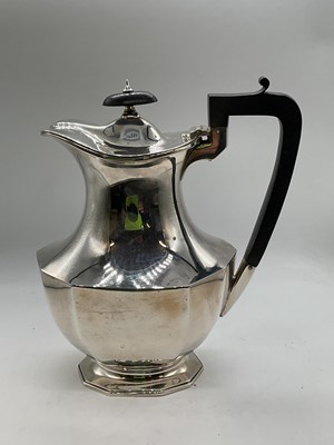Lot 1053 - A George V hallmarked silver hot water pot...