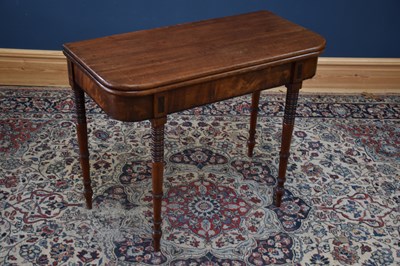 Lot 1047 - A 19th century mahogany foldover tea table on...