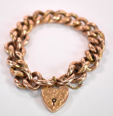 Lot 1143 - A 9ct gold curb link bracelet with heart...