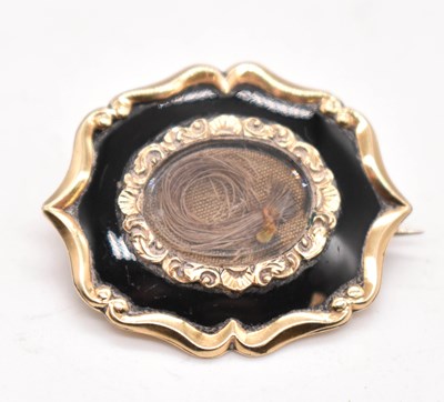Lot 1159 - An early Victorian yellow metal mourning...