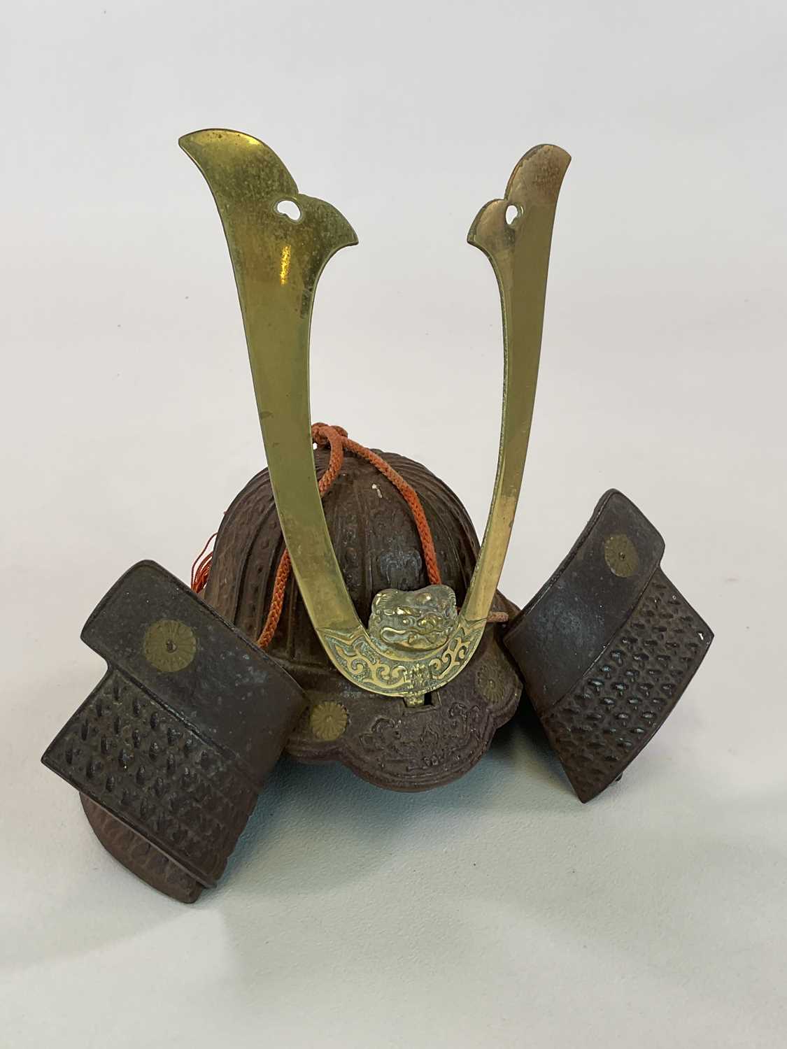 Lot 17 - A Japanese cast metal model of a yoshitsune...