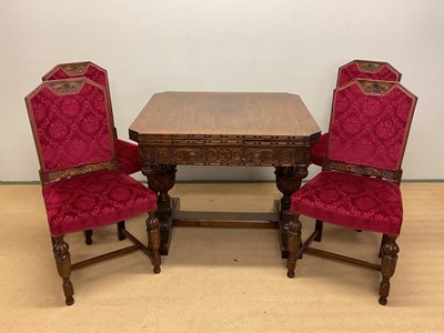 Lot 617 - An oak draw-leaf dining table with well carved...
