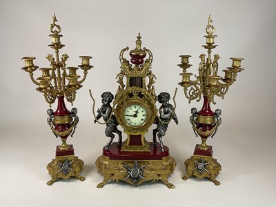 Lot 1365 - A large decorative Italian three piece clock...