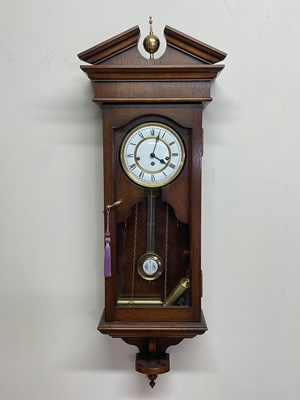 Lot 1368 - A contemporary oak wall clock, height 104cm,...
