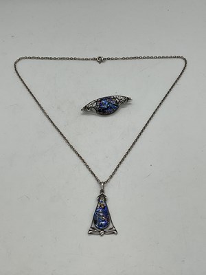 Lot 1247 - An Arts and Crafts silver pendant on chain...