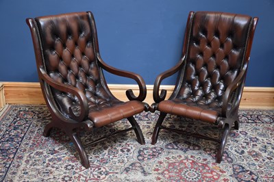 Lot 1105 - A pair of modern brown leather Chesterfield...