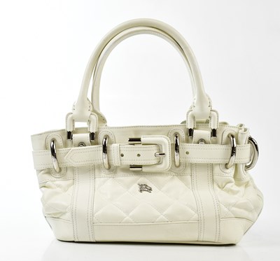 Lot 776 - BURBERRY; a white calfskin leather quilted...