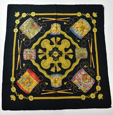Lot 824 - HERMÈS; a 100% silk 'Les Tambours' black, gold...