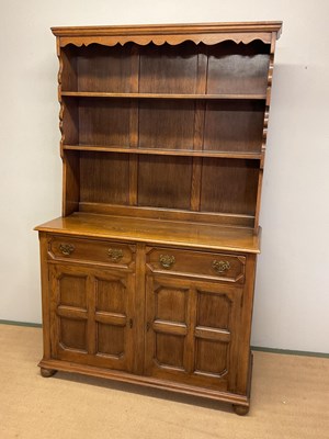 Lot 676 - A reproduction oak dresser with boarded plate...