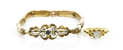 Lot 242 - An 18ct yellow gold diamond illusion set dress...