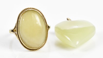 Lot 253 - A 9ct gold and hardstone set dress ring...