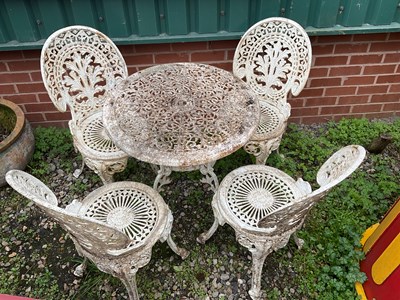 Lot 589 - A white metal circular garden table with four...