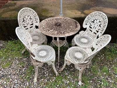 Lot 590 - A white metal circular garden table with four...