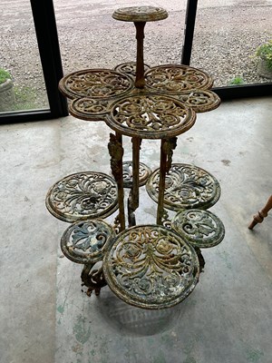 Lot 563 - A cast iron painted plant stand, height 118cm,...