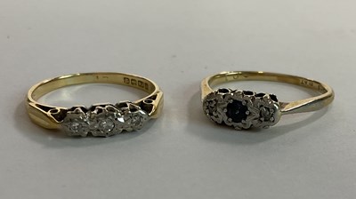 Lot 1139 - An 18ct yellow gold and illusion three stone...