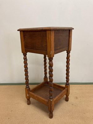 Lot 720 - A 1930's oak jardiniere stand with square tin...