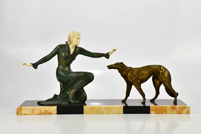 Lot 2064 - An Art Deco patinated spelter and ivorine...