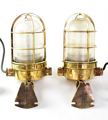 Lot 704 - A pair of ship's brass walkway lamps converted...