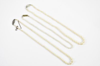 Lot 411 - Three strands of vintage cultured pearls, one...