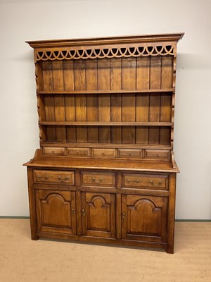 Lot 644 - An oak dresser, the upper section having a...