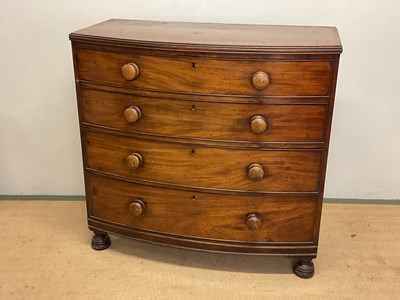 Lot 666 - A mahogany bowfronted chest of four graduating...