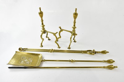 Lot 1425 - A brass companion set including a pair of dogs.