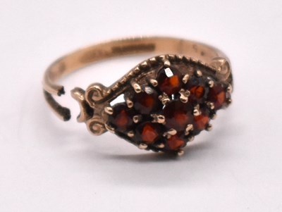 Lot 1218 - A 9ct yellow gold garnet set ring, the shank...