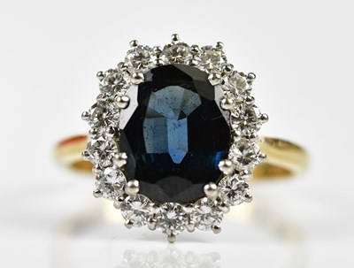 Lot 73 - An 18ct yellow gold sapphire and diamond oval...