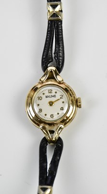 Lot 619 - BAUME; a lady's vintage 9ct yellow gold...