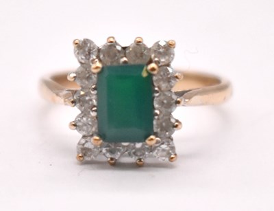 Lot 1215 - A 9ct yellow gold emerald dress ring, size M...