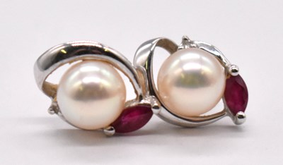 Lot 1216 - A pair of 18ct white gold pearl and ruby ear...