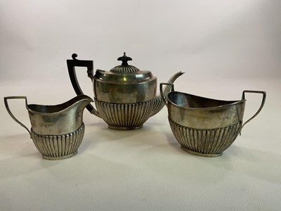 Lot 1015 - A George V hallmarked silver three piece tea...