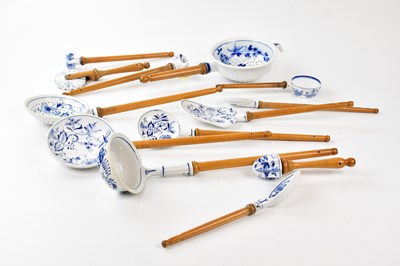 Lot 1247 - In the manner of Meissen; a collection of blue...