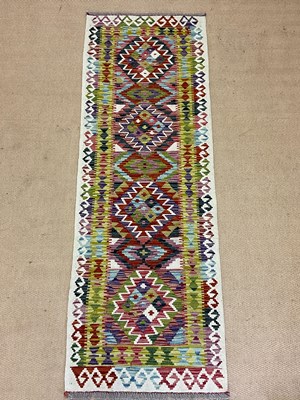 Lot 545 - A Chobi Kilim runner, 193 x 65cm.