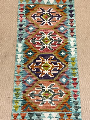 Lot 550 - A Chobi Kilim runner, 147 x 61cm.