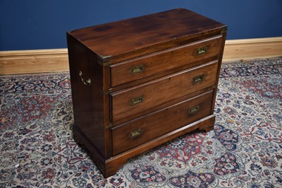 Lot 1021 - An early 20th century teak campaign three...