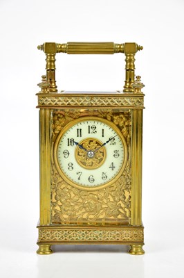 Lot 404 - A brass cased carriage clock, the white enamel...