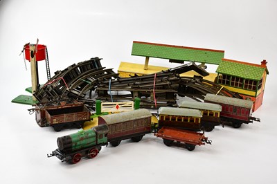 Lot 1466 - HORNBY; a vintage tin plate train set,...