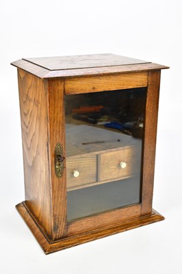 Lot 1312 - An oak smoker's cabinet with two drawers to...